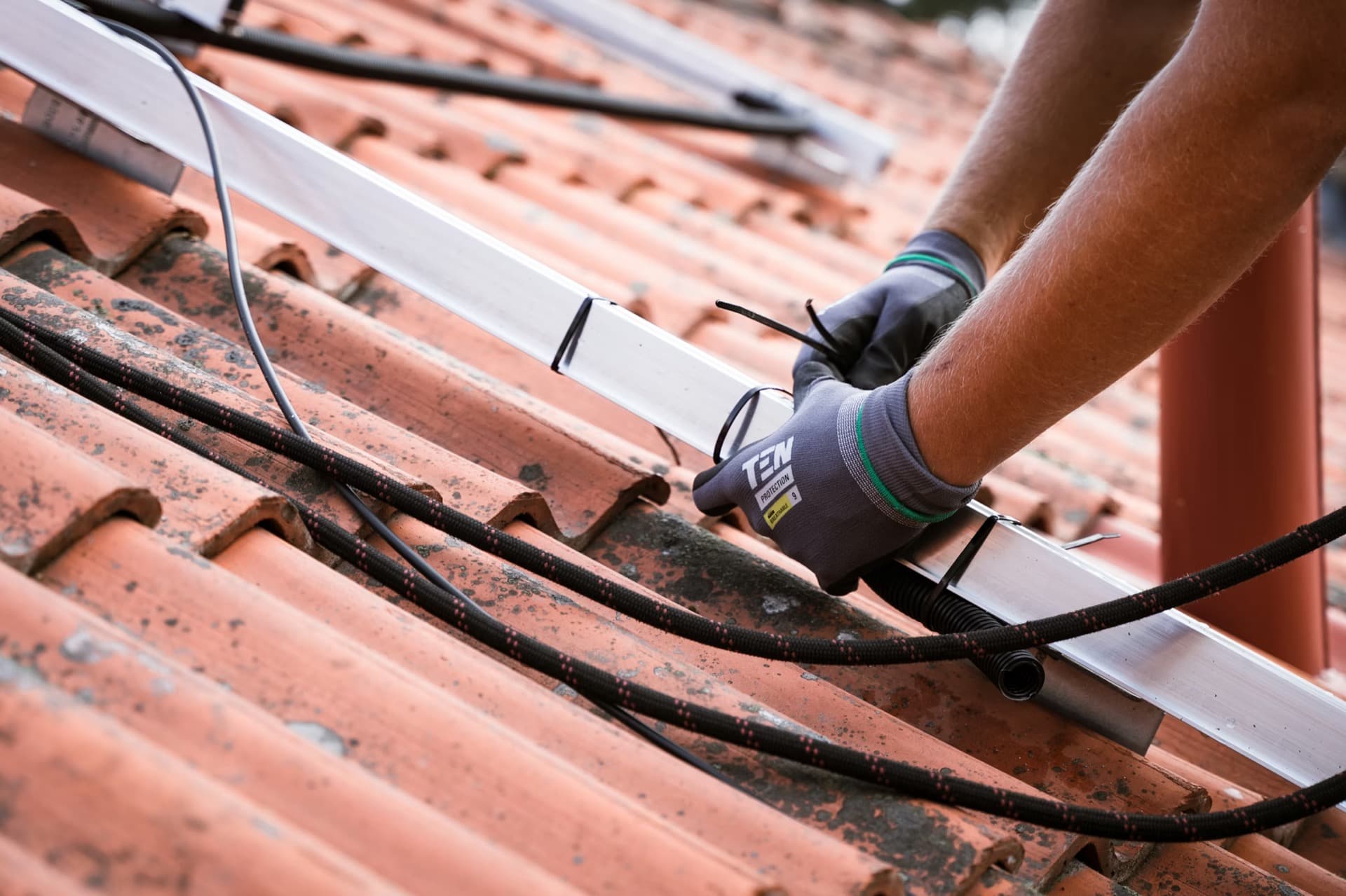Close-up of professional installation work on a home energy system