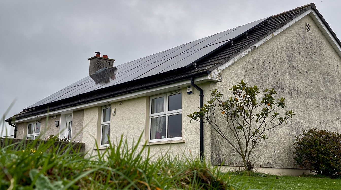 Irish house with solar panels on roof under overcast sky